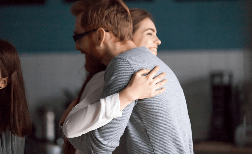 woman and man hugging